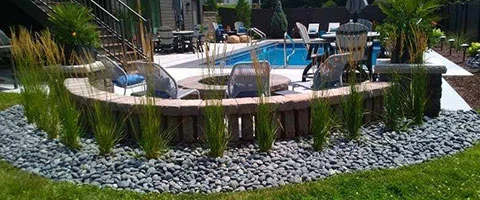 Custom seating wall by a pool at a home in Omaha, NE.